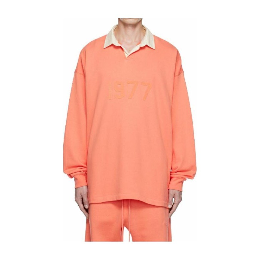 Fear of God Essentials FW22 1977 Henley Rugby in Coral Polo