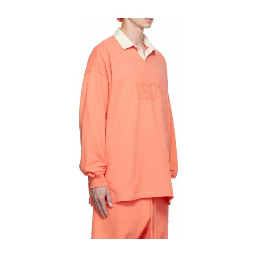 Fear of God Essentials FW22 1977 Henley Rugby in Coral Polo